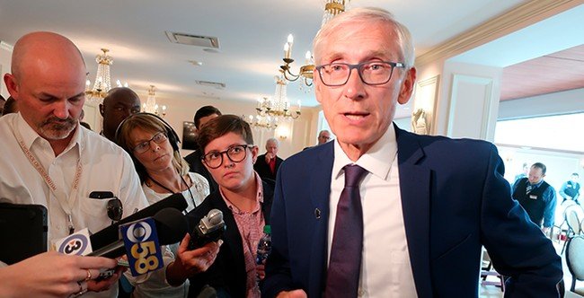 Wisconsin governor delays primary, holds separate high-stakes election